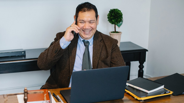 man in office talking on the phone